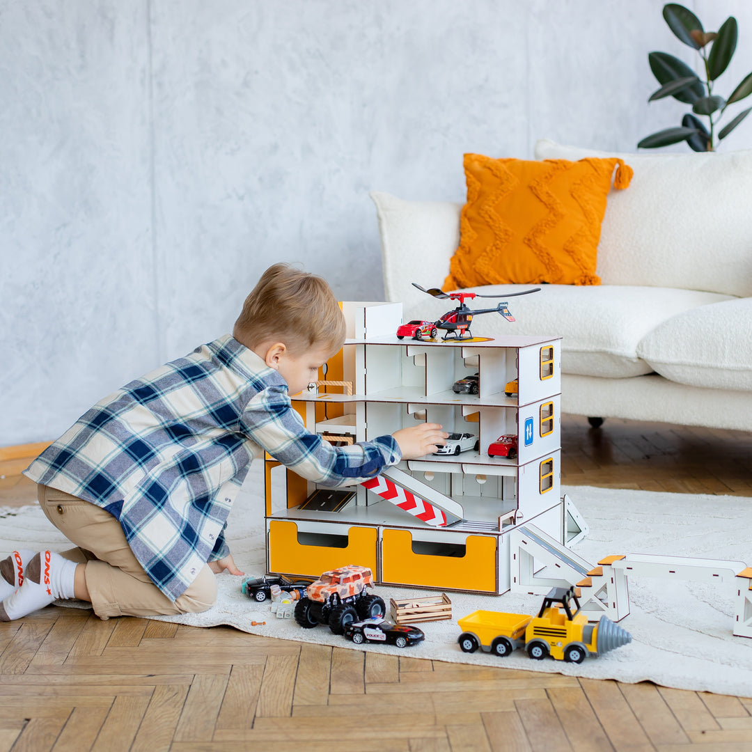 Child playing with a toy garage set in a room, featuring Nestwood branding.