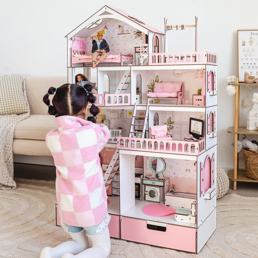 Child playing with a dollhouse in a living room