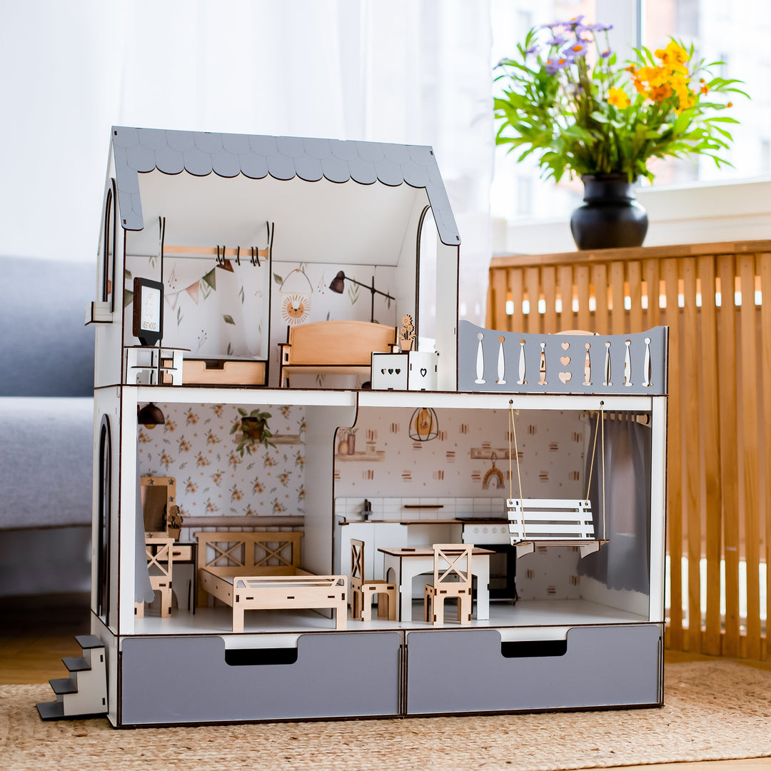 Detailed model of a dollhouse with furniture on a wooden floor.