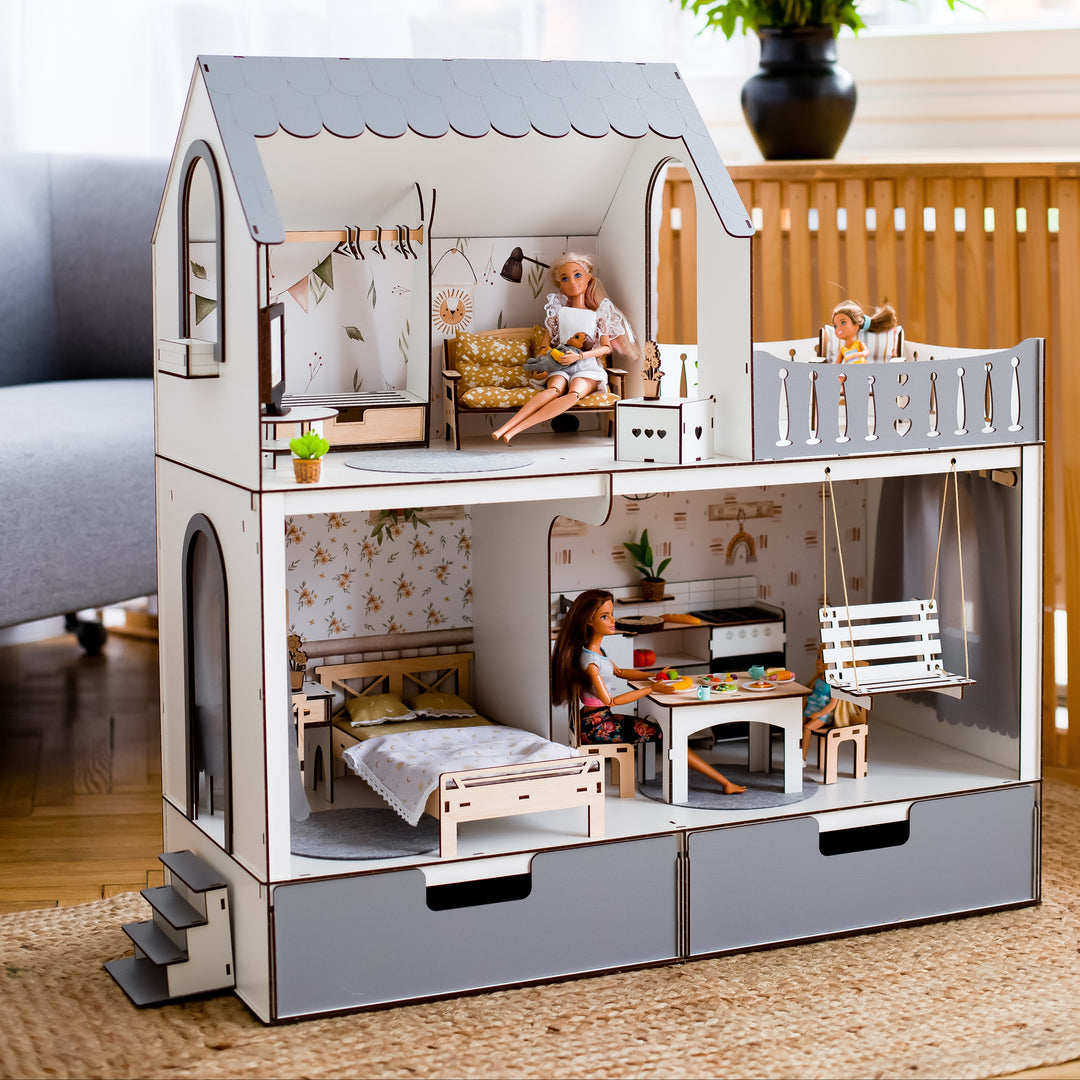 Dollhouse with furniture and dolls in a room setting