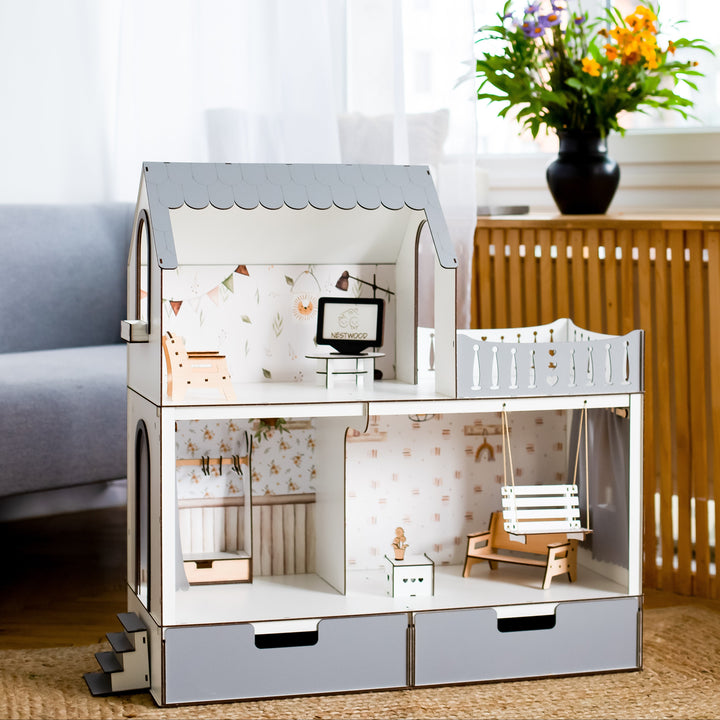 Wooden dollhouse with detailed interior in a room setting