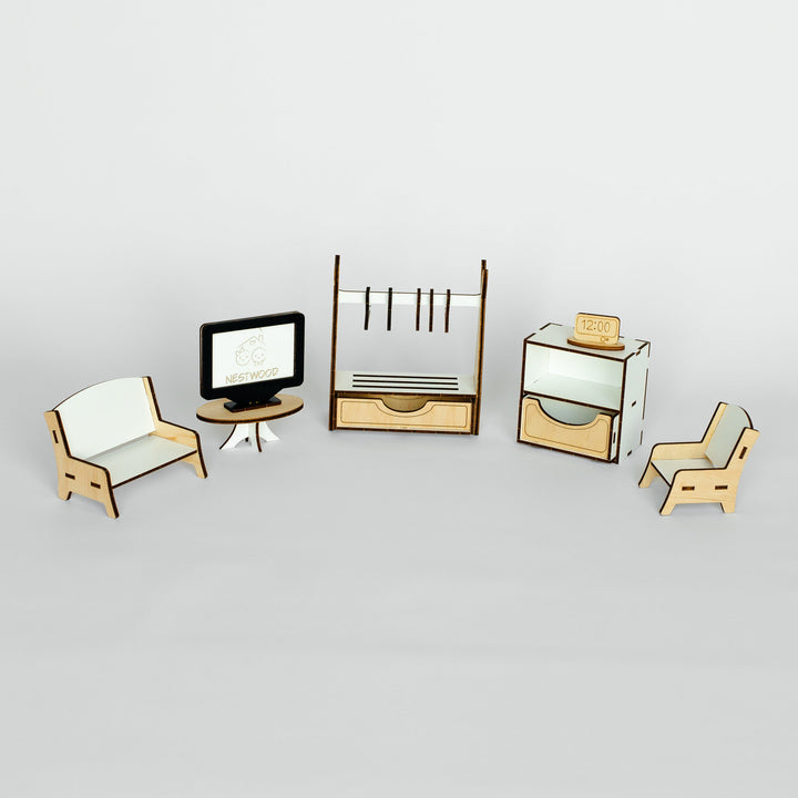 A miniature dollhouse furniture set featuring a small armchair, a computer desk with a monitor, a coat rack, a drawer cabinet, and another armchair, all in a light wood and white finish.