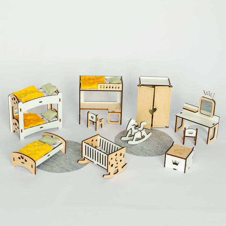 A miniature dollhouse furniture set featuring a wooden bunk bed, single bed, crib, wardrobe, desk, chair, and other accessories, arranged on a light gray background.