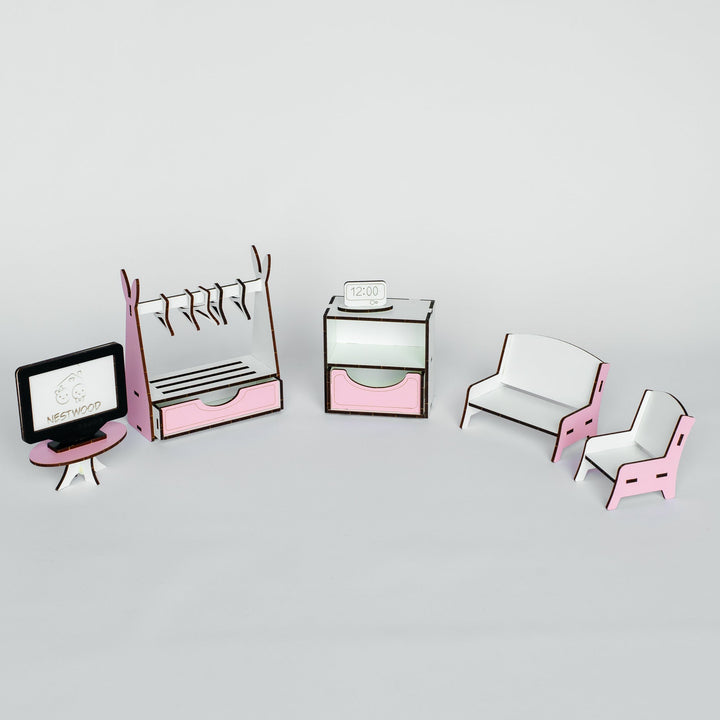 A miniature dollhouse furniture set featuring a pink and white coat rack, a small cabinet, a sofa, and two chairs, displayed on a light gray background.