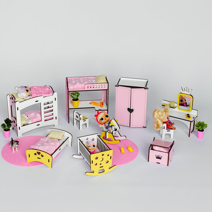 A miniature dollhouse bedroom set featuring a pink and white bunk bed, yellow and white bed, pink wardrobe, desk with vanity, and other accessories, displayed on a light gray background.