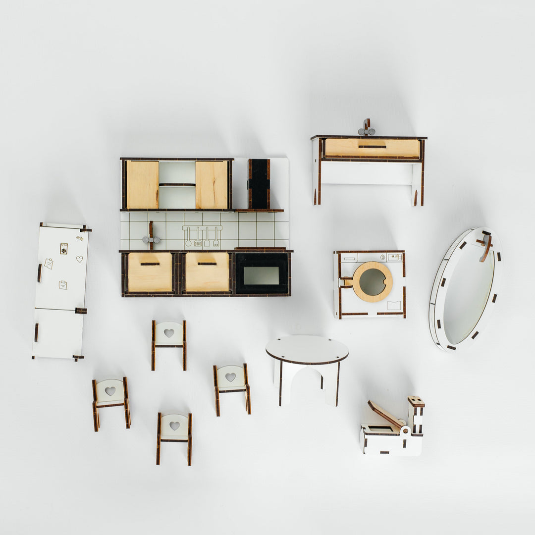 An overhead view of a coordinated furniture set arranged on a clean white background. The set includes multiple chairs, tables, shelving, a console table, a mirror, and a small cabinet, all in a consistent modern design with light wood, white, and dark brown/black elements.
