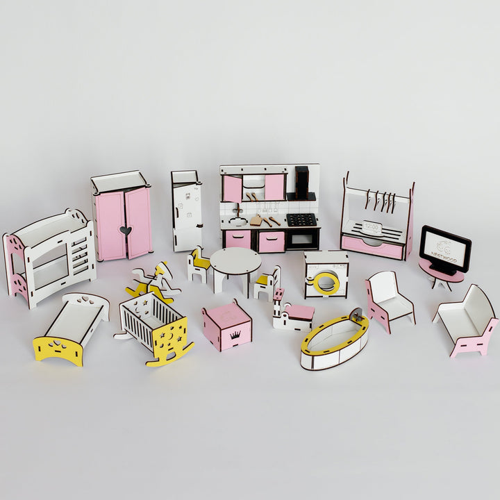 A set of miniature dollhouse furniture pieces and room sets arranged on a light gray background. The collection includes pink and white bedroom, kitchen, nursery, and playroom furniture in a small-scale model kit.