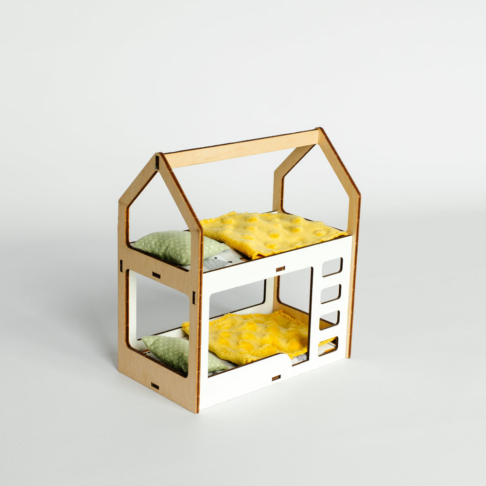 A miniature wooden house-shaped dollhouse bed frame with two levels, shown empty against a clean light gray studio background.