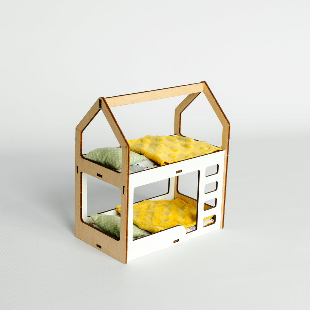 A miniature wooden house-shaped dollhouse bed frame with two levels, shown empty against a clean light gray studio background.