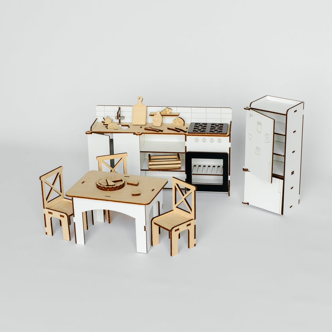 A miniature wooden toy kitchen set with a dining table and two chairs, displayed on a clean light gray background.
