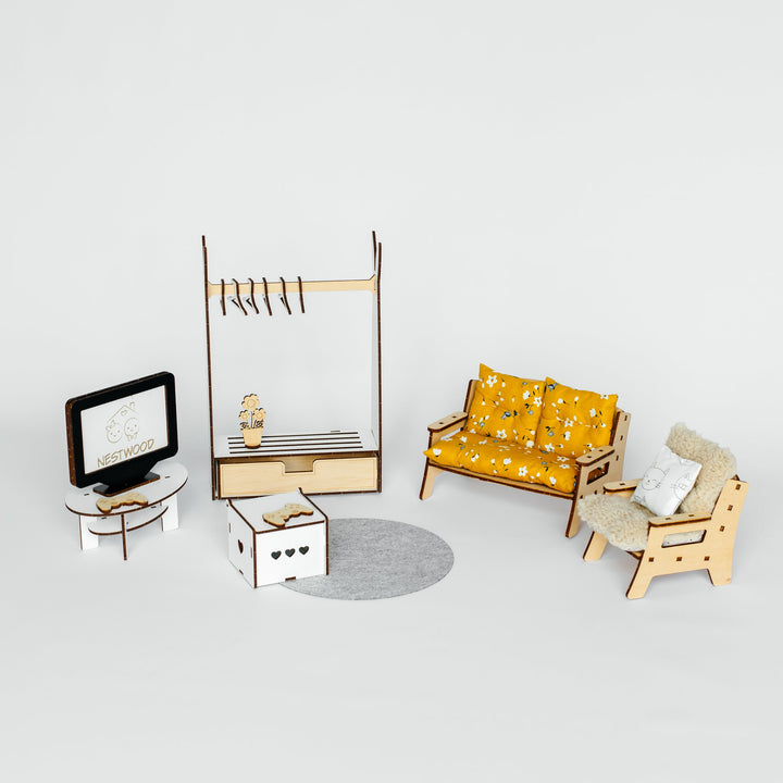 A miniature dollhouse furniture set featuring a yellow floral-patterned loveseat, matching armchair, wooden clothing rack, TV stand, and storage boxes on a light gray background.