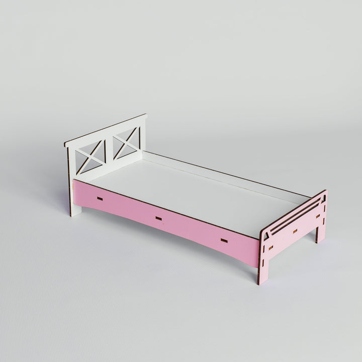 A minimalist wooden bed frame with a light pink footboard and white headboard, shown on a neutral light gray background.