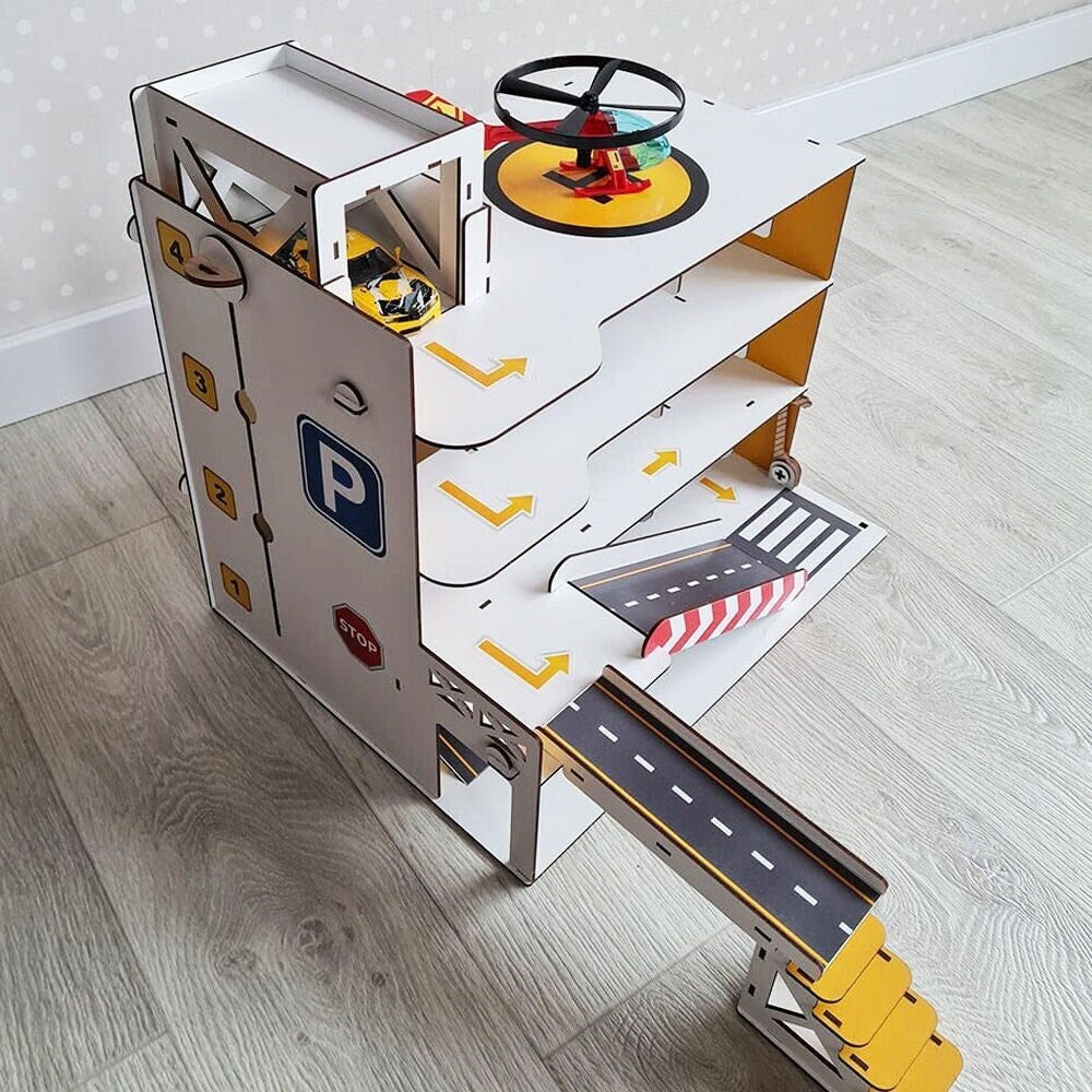 The multi-level structure with a working lift makes it easy to move cars between floors, creating a realistic parking experience.