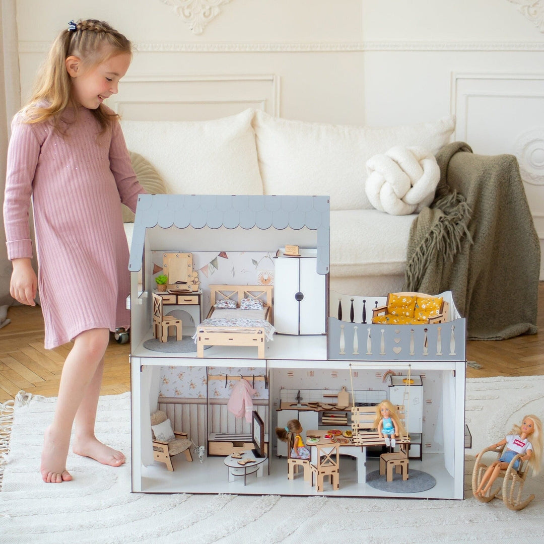 Dollhouse with medium furniture set and child playing with it, accompanied by a list of included items.