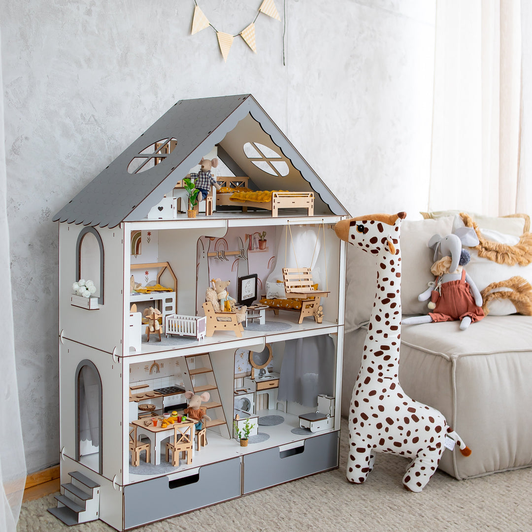 Wooden dollhouse with accessories in a child's room