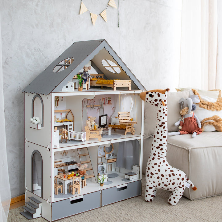 Wooden dollhouse with accessories in a child's room
