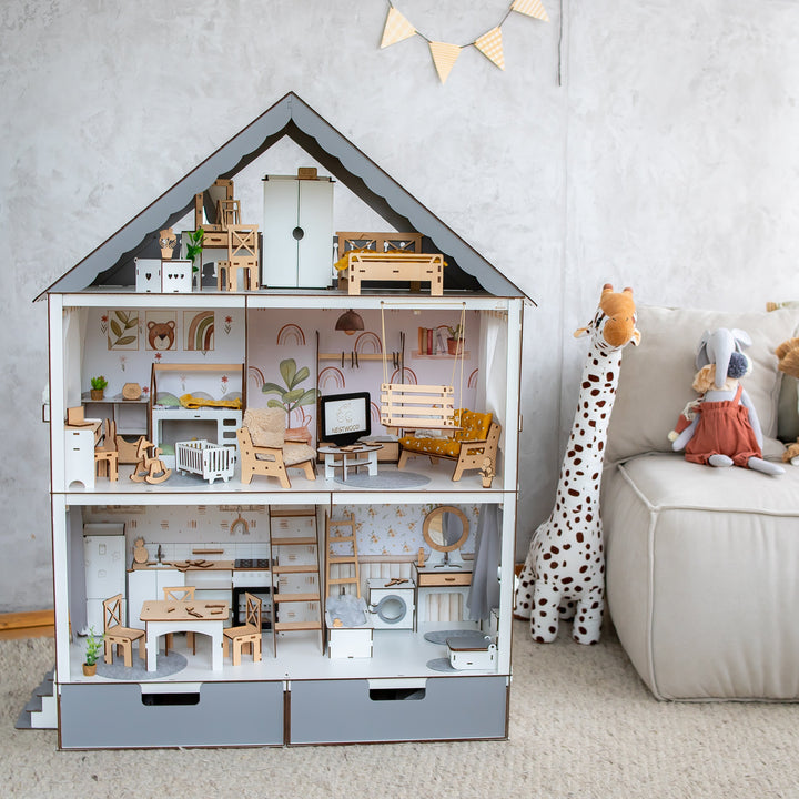 Wooden dollhouse with furniture in a child's room