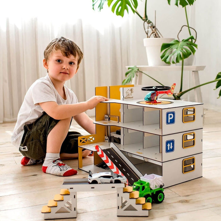 This wooden car garage with elevator (Holz Parkhaus) is designed for active and imaginative play, giving kids a dynamic space to drive, park and explore.