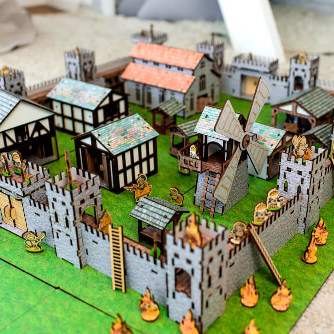 A wooden medieval castle playset featuring a modular design for creative role-play. Includes toy knights, catapults, and fortress walls, perfect for kids’ medieval battles. An eco-friendly wooden toy, designed as a 3D puzzle castle